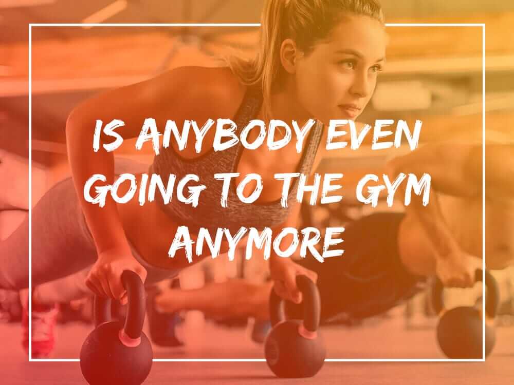 Woman performing push-ups with dumbbells in a gym questioning gym attendance; XBAR Fitness revolution fitness trend.