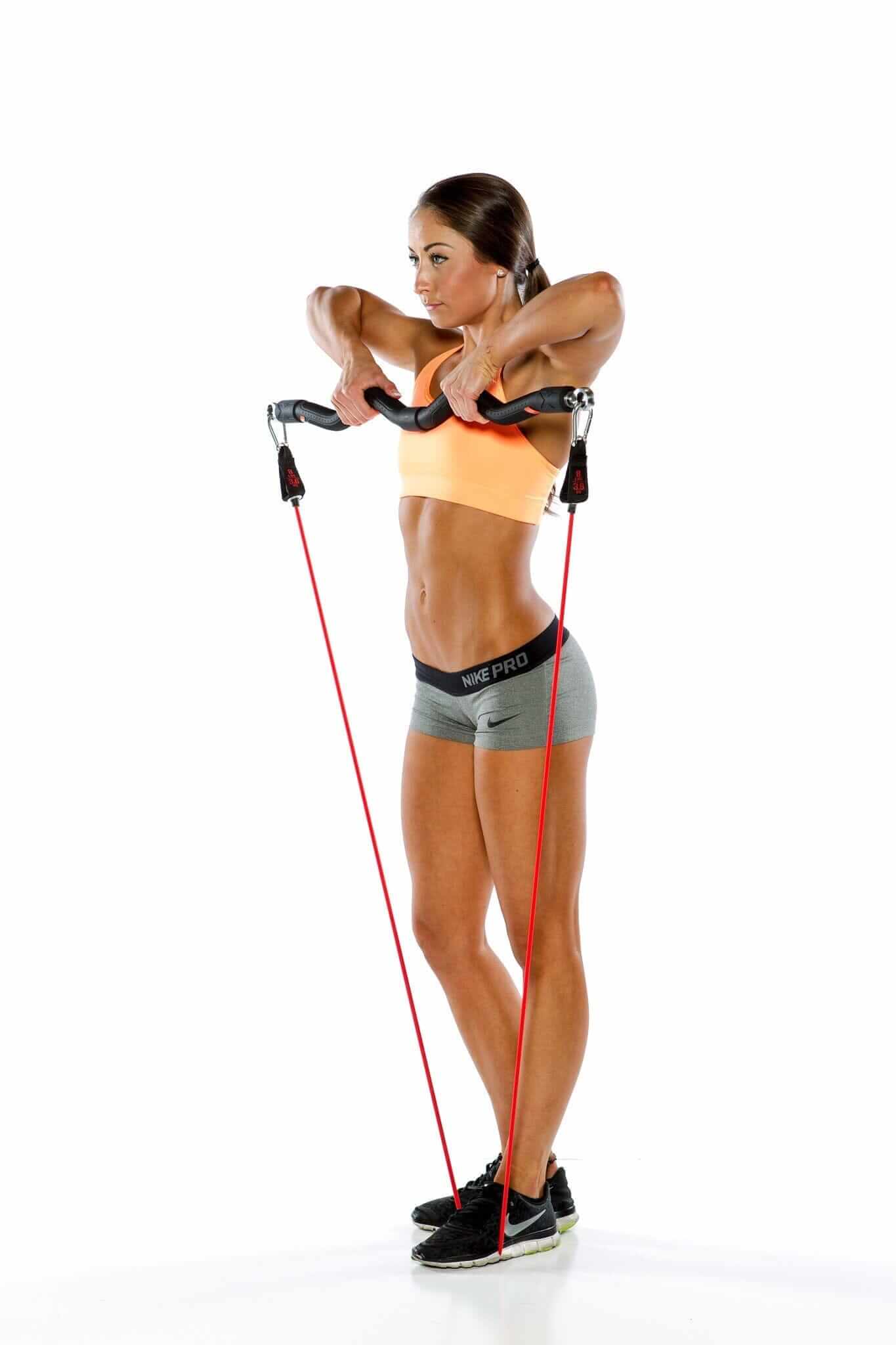 Person demonstrating the XBAR resistance band system with a powerful workout pose.
