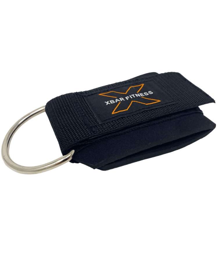 black ankle strap with a D-ring clip on a transparent background, featuring the XBar Fitness logo.