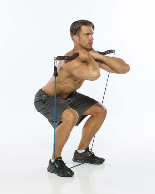 Man performing front grip squats with xbar