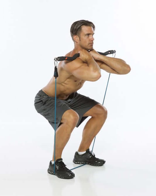 Man performing front grip squats with xbar