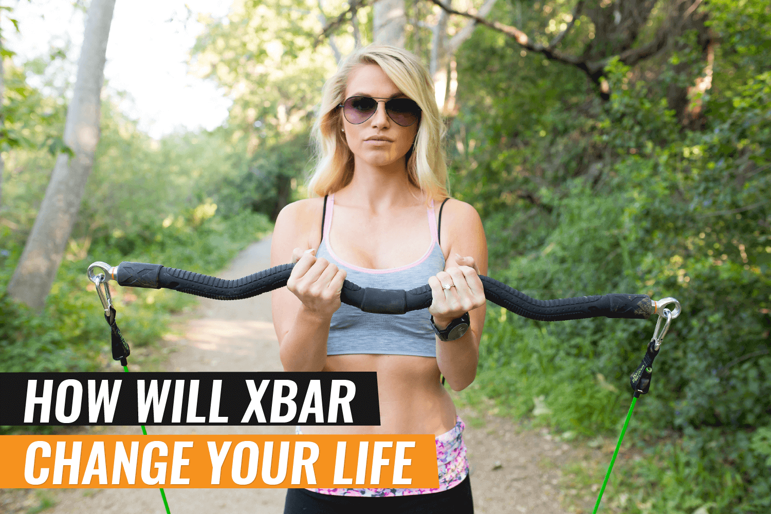 Woman using xbar fitness system in a scenic outdoor setting for a transformative workout experience.