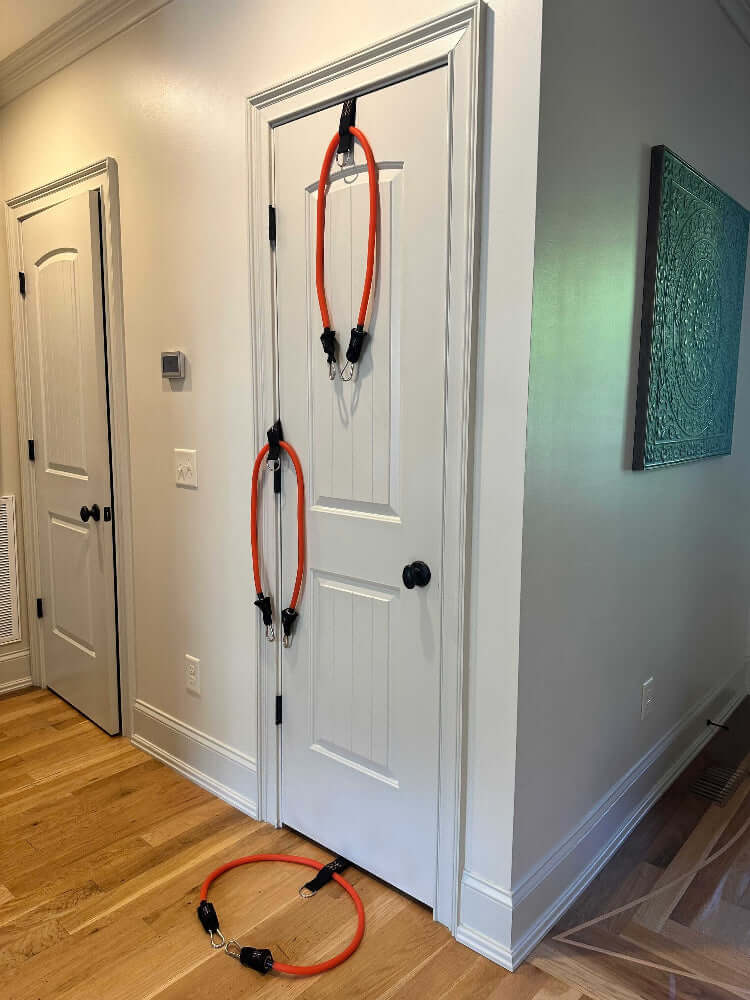 Heavy Duty Door Anchor Fitness accessory showcasing three different positions at the low, medium, and high positions allowing for a variety of different angles.