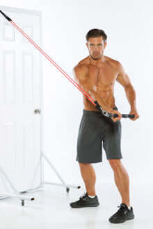 Man using xbar door anchor for resistance chops exercise