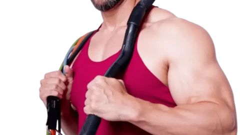 Man holding resistance bands against ready to use his portable home gym system.